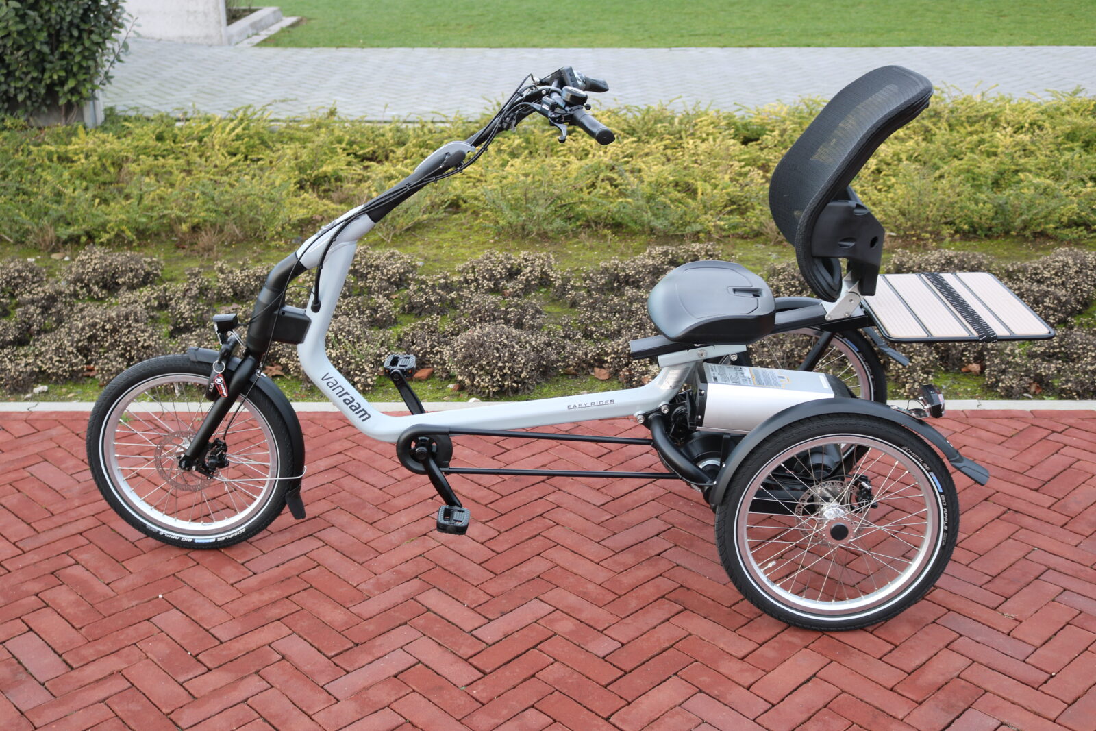 Image of a silver adult's tricycle.